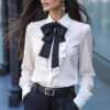 women’s ruffle trim blouse with black bow tie